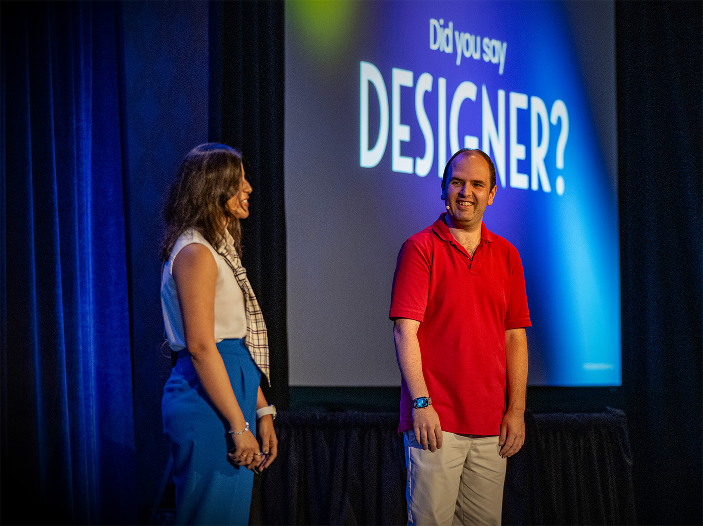 Rehan and Ruchita on stage with 'Did you say designer?' behind us on screen