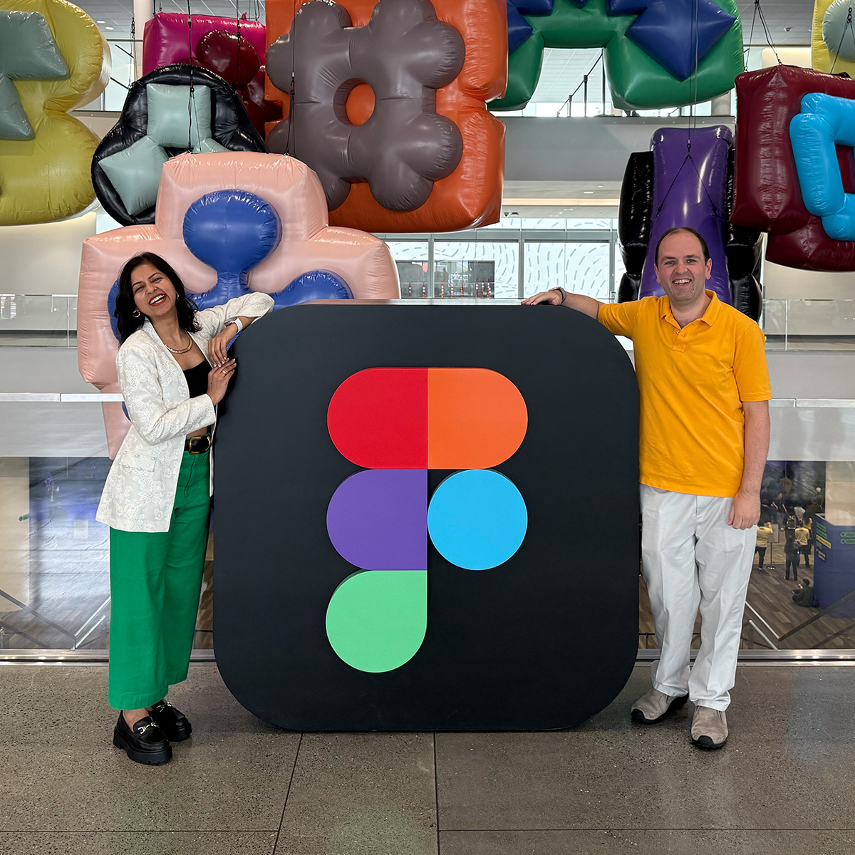 Rehan and Ruchita at the Figma logo at Config 2025