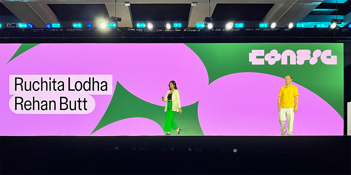 Rehan and Ruchita walking on stage for our talk at Config 2025